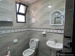 a bathroom with a toilet and a sink at dar naim in Chefchaouen +50 photos