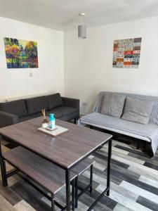 a living room with a coffee table and a couch at Middlecroft in Chesterfield