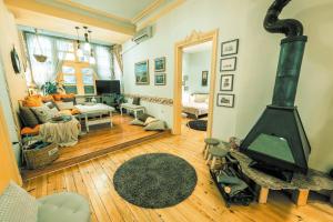 a living room with a wood stove in it at TOMOVI HOME - Three bedrooms City center in Plovdiv