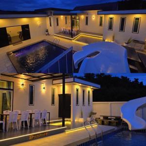 a house with a swimming pool at night at 65 Poolvilla in Ban Tao Than