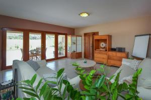 a living room with a couch and a table at Arantxa Residence in Noord