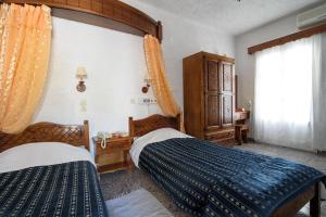 Voodi või voodid majutusasutuse Hotel Porto Perissa toas