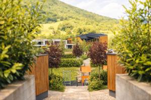 a view of a house with a fence at Mobile Homes Camping Plitvice in Smoljanac