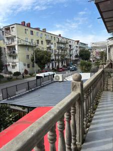 a walkway with a red carpet and buildings at bubu in Kobuleti