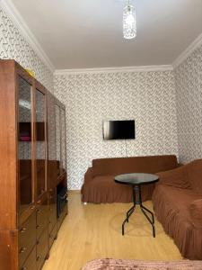a living room with a couch and a table at bubu in Kobuleti