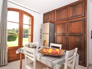 a kitchen with a table with a basket of fruit on it at Apartment Le Platane by Interhome in Velleron