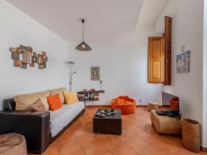 a living room with a couch and a table at Holiday Home Rua 5 de Outubro by Interhome in Lagos