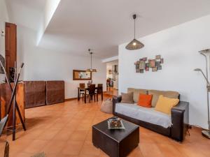 a living room with a couch and a table at Holiday Home Rua 5 de Outubro by Interhome in Lagos
