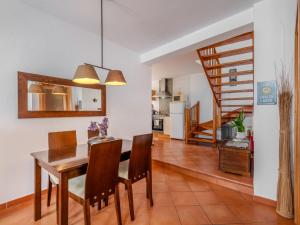 a kitchen and dining room with a table and chairs at Holiday Home Rua 5 de Outubro by Interhome in Lagos +26 photos