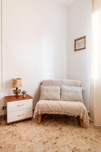 a white room with a bed and a dresser at Casa Bra-Z 10m da Arena Verona e Stazione Porta Nuova - 7Px in Verona +22 photos