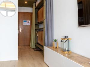 a hallway with a door leading into a room at Studio Rosablanche D63 by Interhome in Siviez