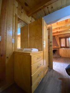 a room with a wooden cabinet with a window at Vistas NO 5 in Mazamitla