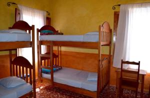 Hostel Iguana Azul tesisinde bir odada yatak veya yataklar