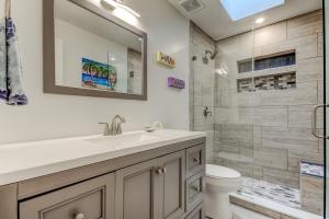 a bathroom with a sink and a toilet and a shower at Indian Rocks Beach West Side Bungalow in Clearwater Beach +23 photos