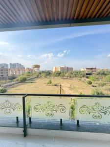 a view of a field from a window at Shri Prem Sharnam - By The Aureo Hotels in Vrindāvan