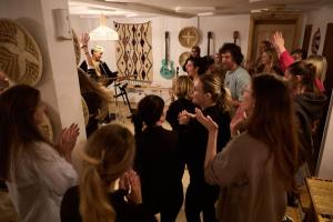 a group of people standing in a room at Aman surf paddle yoga in Imsouane