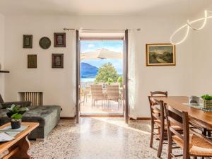 a living room with a couch and a table at Apartment Onda Blu by Interhome in Gera Lario