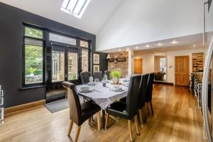 a dining room with a table and black chairs at 4 Bed in Helmsley oc-y039 in Helmsley