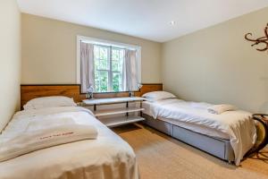 three beds in a room with a window at 4 Bed in Helmsley oc-y039 in Helmsley