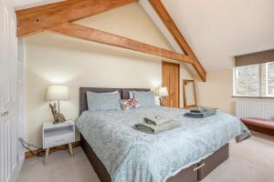 a bedroom with a large bed and a window at 3 Bed in Holsworthy oc-29125 in Thornbury