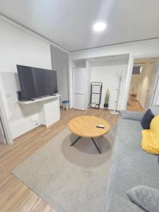a living room with a couch and a table at Las vegas in Alcorcón