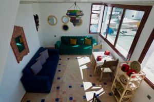 a living room with a couch and a table at CASA ADiL in Tangier