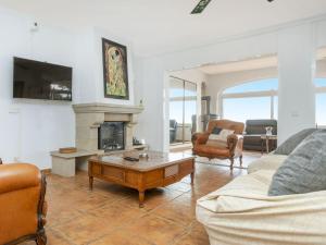 a living room with a couch and a coffee table at Holiday Home Floramar by Interhome in Lloret de Mar