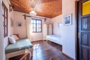 a room with two beds and a door at Guest House Sklithro in Sklíthron