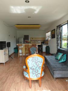 a living room with a couch and a table at Finca Montenegro Quindio in Montenegro