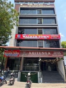 two motorcycles parked in front of a building at Hotel Elite Walker Town in Hyderabad