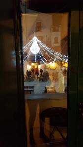 a reflection of a tent with lights in a window at Casa Cardi in Sperlonga