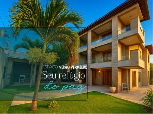 a rendering of a villa with a palm tree at Espaço Verão Vermelho in Cabo Frio