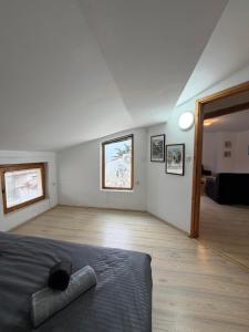 a white room with a bed and a room with a room at Villa Fantasy Premium Lakeview in Ohrid