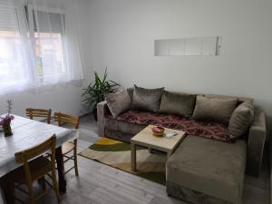 a living room with a couch and a table at Gorica in Negotin