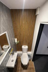 a bathroom with a white toilet and a sink at Amsterdam Hotel in London +16 photos