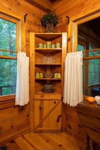 a kitchen in a log cabin with a pantry at Creek Crest Cabin Ocoee Riverside Cabin in Ocoee +34 photos