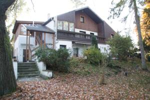 a house with a staircase in front of it at Pension Fischer in Plauen