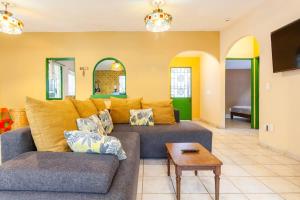 a living room with a couch and a table at El Apapacho in Cuernavaca