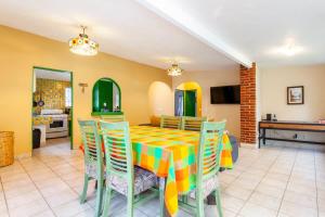 a dining room with a table and chairs at El Apapacho in Cuernavaca +66 photos