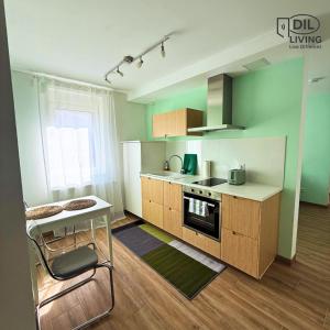 a kitchen with a counter and a table and a stove at Modern - zentral - Studio mit Küche - Self Check In in Bad Nauheim