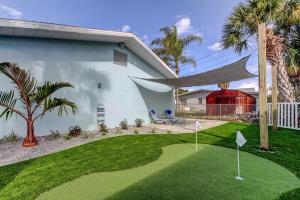 a golf course in front of a house at Indian Rocks Beach West Side Bungalow in Clearwater Beach