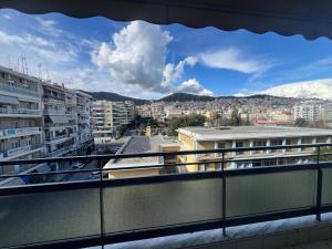 a view of a city from the balcony of a building at A&S Luxury Apartment in Kavála