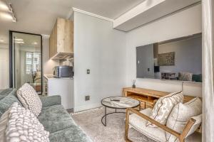 a living room with a couch and a table at Caica Executives at Ellipes 4202 in Midrand