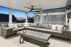 a living room with a couch and a table at New Luxury Home Heated Pool & Spa in New Orleans