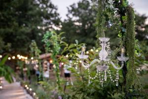 a row of hanging lights in a garden at Bungalow TRADICIONS en FincaReal in Negreira