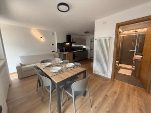 a dining room with a table and chairs in a room at Al Piz - Dimora Alpina in Pellizzano +13 photos