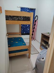 a bunk bed in a room with a window at Habitus in Shah Alam +9 photos