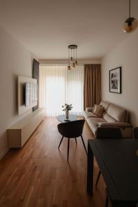 a living room with a couch and a table at Adria Gold - Bayview - Luxury in Kotor