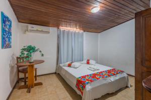 Giường trong phòng chung tại Pousada Brisa do Mar