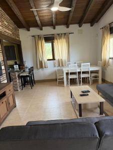 a living room with a couch and a table at Los Royares in Candeleda